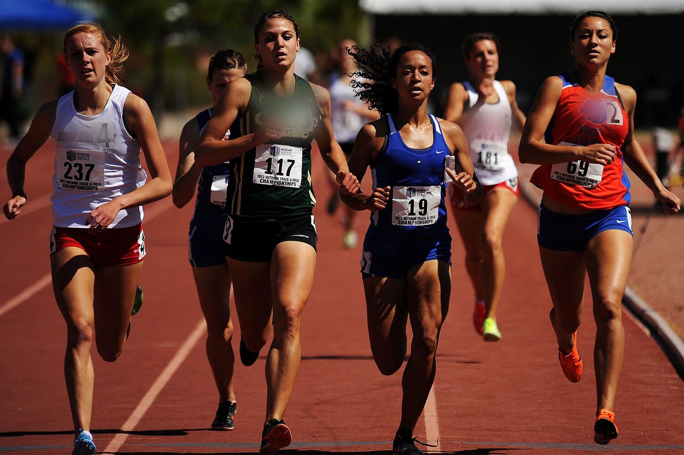 A pack of 800 meter runners in the final straight