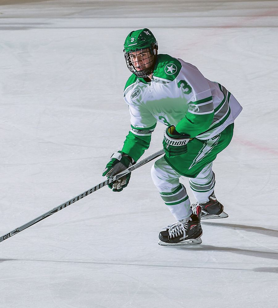 A Timberwolves forward carries the puck up the ice