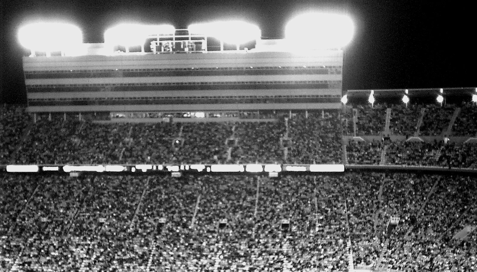 Packed stands under stadium lights