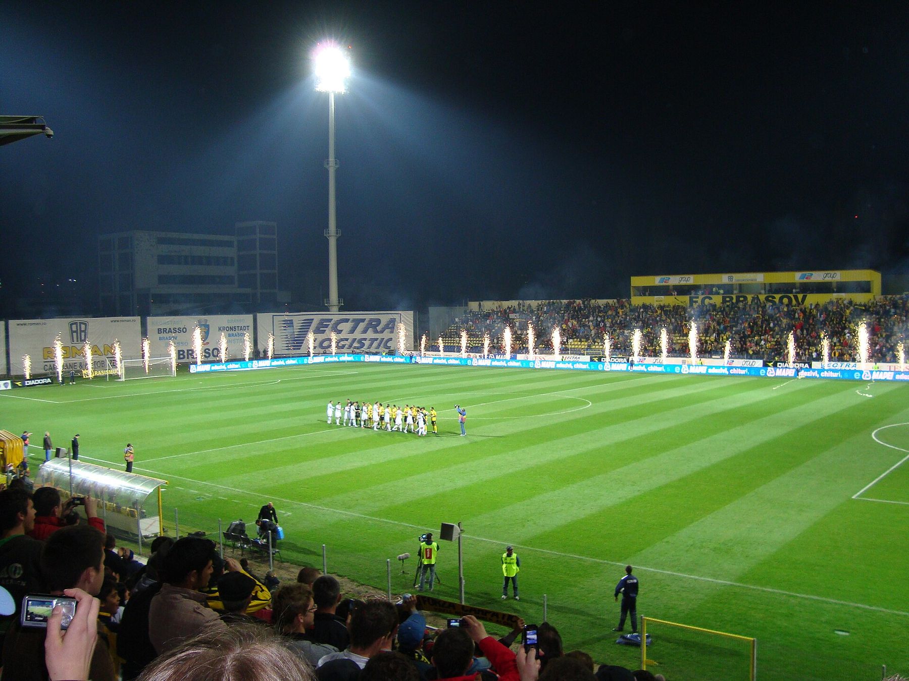 Stadium lights over the field before kickoff