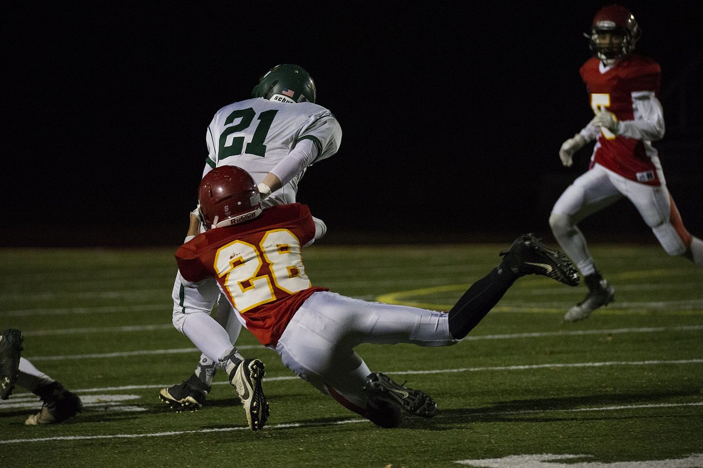 A Panthers defender makes a diving tackle